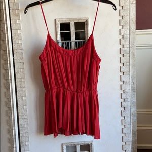 Strappy red peplum shirt.